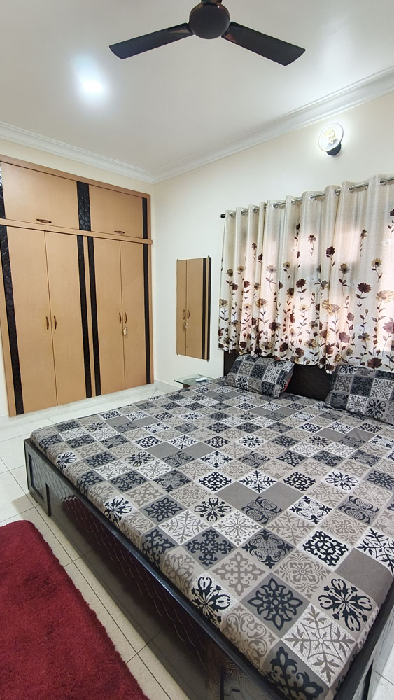 Bedroom with wardrobe at Sumerpur Cottage